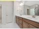 This bathroom features a double vanity and a large mirror at 95 Autumnwood Ln, Spring Hope, NC 27882