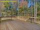 Back deck overlooking a wooded yard at 95 Autumnwood Ln, Spring Hope, NC 27882