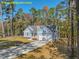 This single-Gathering home sits on a wooded lot and features an attached two-car garage at 95 Autumnwood Ln, Spring Hope, NC 27882