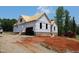 New home with brick foundation under construction and clear blue skies at 95 Autumnwood Ln, Spring Hope, NC 27882