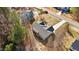 Home's setting is showcased in this aerial view, with mature trees and a long driveway at 95 Leisure Ln # 9, Louisburg, NC 27549