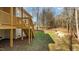 Image highlighting the deck with stairs in the backyard and natural surroundings at 95 Leisure Ln # 9, Louisburg, NC 27549