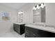Bathroom featuring dual vanities, marble countertops and tiled floor at 95 Leisure Ln # 9, Louisburg, NC 27549
