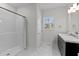 Bright bathroom features a marble countertop vanity, tiled floors and shower at 95 Leisure Ln # 9, Louisburg, NC 27549