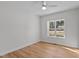 Bright bedroom with hardwood floors, ceiling fan and large window at 95 Leisure Ln # 9, Louisburg, NC 27549