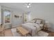 Serene bedroom featuring natural light, a cozy bed, and stylish decor at 95 Leisure Ln # 9, Louisburg, NC 27549