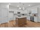 Modern kitchen featuring white cabinets, granite countertops, and stainless steel appliances at 95 Leisure Ln # 9, Louisburg, NC 27549