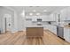 Modern kitchen featuring white cabinets, granite countertops, and stainless steel appliances at 95 Leisure Ln # 9, Louisburg, NC 27549