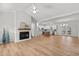 Open concept living space featuring fireplace, hardwood floors and kitchen at 95 Leisure Ln # 9, Louisburg, NC 27549