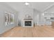 Bright living room with fireplace, ceiling fan and hardwood floors at 95 Leisure Ln # 9, Louisburg, NC 27549