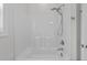 A clean, well-lit shower featuring white acrylic walls and modern fixtures at 95 Leisure Ln # 9, Louisburg, NC 27549