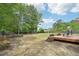 Expansive backyard with a wooded area providing privacy and a natural setting at 100 Winterberry Ln, Holly Springs, NC 27540