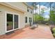 Backyard deck with chairs, with home's exterior and sliding glass door at 100 Winterberry Ln, Holly Springs, NC 27540