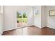 Dining room area features hardwood floors, slider to backyard, and natural light at 100 Winterberry Ln, Holly Springs, NC 27540