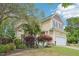 Charming two-story home with well-manicured landscaping, attached two-car garage, and inviting curb appeal at 100 Winterberry Ln, Holly Springs, NC 27540