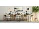 Bright home office space with multiple desks, chairs, monitors, and decorative art creating a functional work environment at 1012 Red Roses Ave, Durham, NC 27703