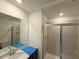 Modern bathroom with a glass-enclosed shower, sleek vanity, and contemporary fixtures at 1031 Mountain Crown St, Durham, NC 27703