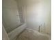 A simple bathroom with a white bathtub and fixtures, ready for finishing touches at 1031 Mountain Crown St, Durham, NC 27703