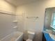 Clean, practical bathroom with a tub, and a single sink vanity with a large mirror at 1031 Mountain Crown St, Durham, NC 27703