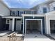 Charming two-story home with a covered entrance and an attached, spacious one-car garage at 1031 Mountain Crown St, Durham, NC 27703