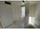 A hallway featuring white walls, trim, and doors leading to different areas of the home at 1031 Mountain Crown St, Durham, NC 27703
