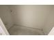 A small room with white walls and concrete floors, showcasing basic utility provisions at 1031 Mountain Crown St, Durham, NC 27703