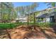 Private backyard with mature trees and a pergola, create an ideal outdoor living space at 10609 Lowery Dr, Raleigh, NC 27615