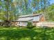 A spacious backyard presents beautiful scenery and a well-maintained lawn at 10609 Lowery Dr, Raleigh, NC 27615