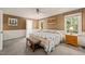 Comfortable bedroom with connecting bathroom, natural light, and light brown walls at 10609 Lowery Dr, Raleigh, NC 27615