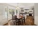 Bright and airy dining area with large windows and seamless kitchen access at 10609 Lowery Dr, Raleigh, NC 27615