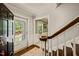 Warm entryway with wood floors, staircase, and bright natural light at 10609 Lowery Dr, Raleigh, NC 27615