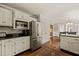 Spacious kitchen boasts stainless appliances, ample counter space, and eat-in area at 10609 Lowery Dr, Raleigh, NC 27615