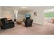 Inviting living room featuring neutral walls, plush seating, natural light, and carpet, offering a relaxing atmosphere at 10609 Lowery Dr, Raleigh, NC 27615