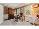 Comfortable office space with large windows, neutral carpet and classic desk at 10609 Lowery Dr, Raleigh, NC 27615