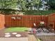 Outdoor space is fenced in with an artificial grass portion and seating at 10943 Pendragon Pl, Raleigh, NC 27614
