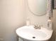 Close-up of a bathroom sink with elegant fixtures and ample counter space at 10943 Pendragon Pl, Raleigh, NC 27614