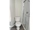 Bathroom featuring a toilet and a glass-enclosed shower at 10943 Pendragon Pl, Raleigh, NC 27614