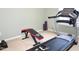 Home gym with treadmill, weight bench and dumbbells for a complete workout at 10943 Pendragon Pl, Raleigh, NC 27614