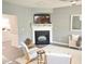 Bright living room featuring a fireplace and neutral furnishings at 10943 Pendragon Pl, Raleigh, NC 27614