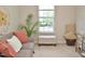 Cozy living room features neutral tones, a comfortable sofa, and natural light at 10943 Pendragon Pl, Raleigh, NC 27614