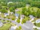 Aerial view of a residential neighborhood showcasing well-maintained homes with lush green lawns and mature trees at 11 Glen Valley Ct, Angier, NC 27501