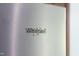 Close-up on a silver Whirlpool fridge with the logo prominently displayed at 11 Glen Valley Ct, Angier, NC 27501