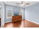 Bedroom with hardwood floors, ceiling fan, dresser, and two windows at 11 Glen Valley Ct, Angier, NC 27501