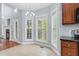 Bright breakfast nook features a fireplace and ample sunlight from numerous windows, and open floorplan at 11 Glen Valley Ct, Angier, NC 27501