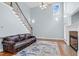 The living room has hardwood floors, a ceiling fan, and stairs leading to the second level at 11 Glen Valley Ct, Angier, NC 27501