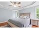 Charming main bedroom features a ceiling fan, tray ceiling, and lots of natural light at 11 Glen Valley Ct, Angier, NC 27501