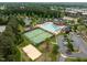 Community amenities featuring a pool, tennis courts, and clubhouse in a beautifully landscaped setting at 1109 Renewal Pl, Raleigh, NC 27603