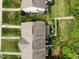 Bird's eye view of a home's roof and fenced backyard with a fire pit at 1109 Renewal Pl, Raleigh, NC 27603