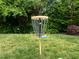 Backyard disc golf setup with lush lawn and mature trees, ideal for outdoor fun at 1109 Renewal Pl, Raleigh, NC 27603