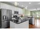 Modern kitchen with stainless steel appliances, granite countertops, and pendant lighting at 1109 Renewal Pl, Raleigh, NC 27603